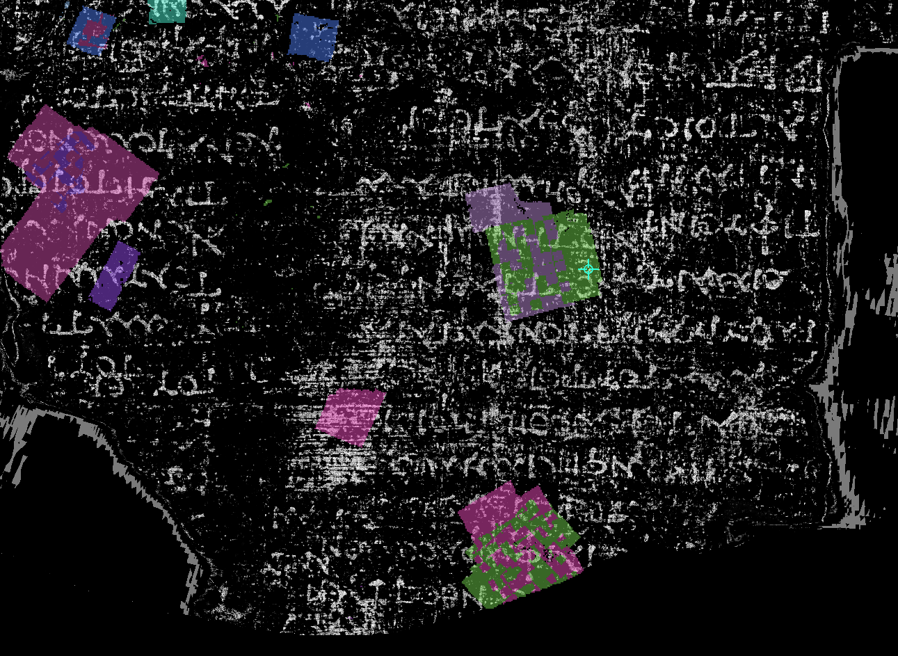 A sparse set of colored local surface-patch annotations in a scroll-volume region